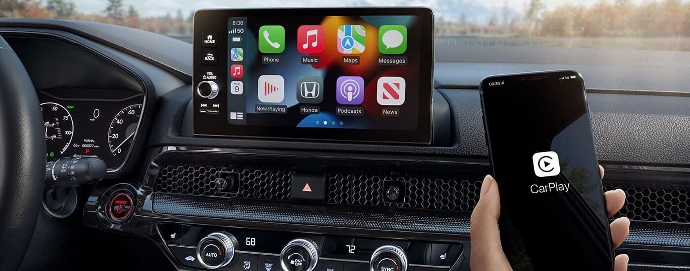 The Apple Carplay feature is shown in a 2023 Honda CR-V Hybrid.