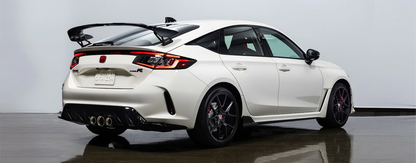 A white 2023 Honda Civic Type R is shown from the rear.