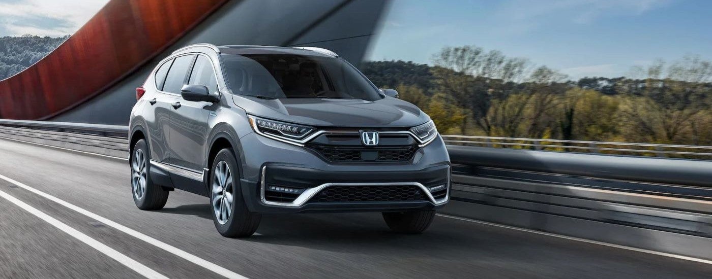 A grey 2020 Honda CR-V Hybrid is shown from the front at an angle.