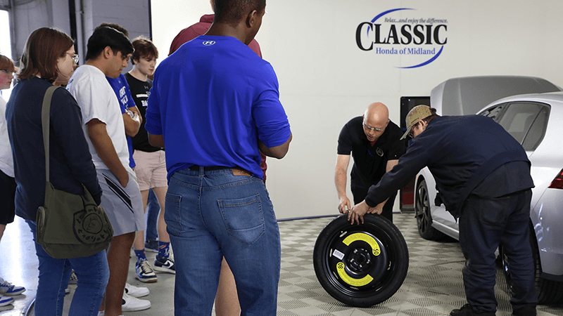 Classic Honda team members show tire maintenance