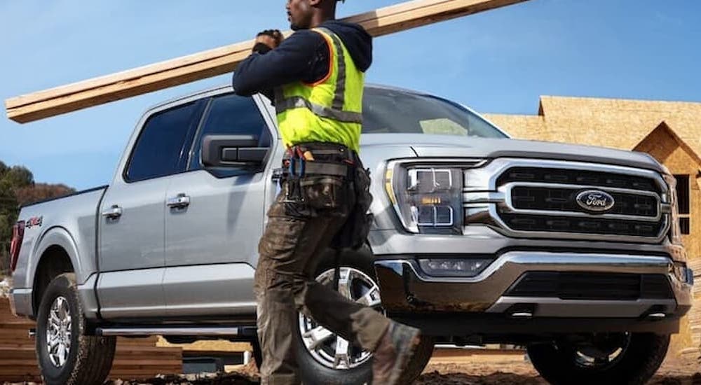 A 2022 Ford F-150 XLT is shown parked at a construction site.