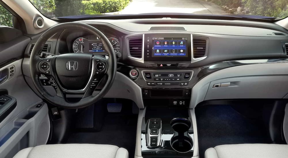 The grey interior of a 2024 Honda Ridgeline is shown from above the center console.