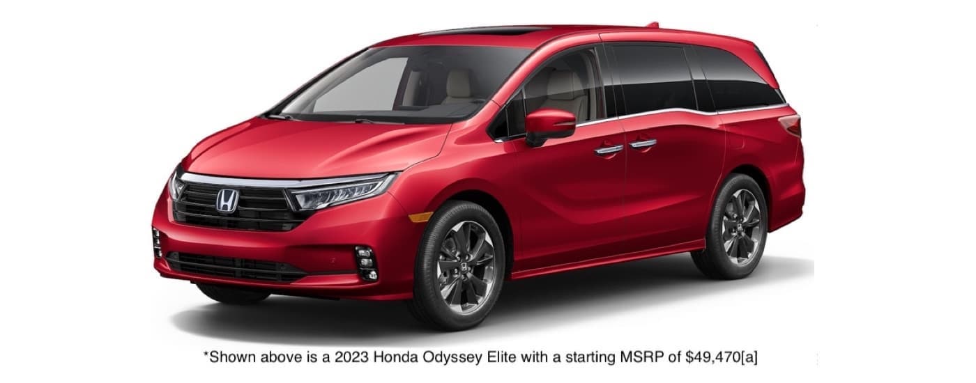 A red 2023 Honda Odyssey Elite is shown angled left.