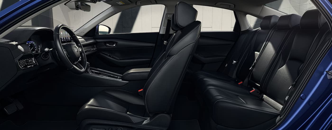 A side view of the black interior of a blue 2024 Honda Accord Touring is shown.